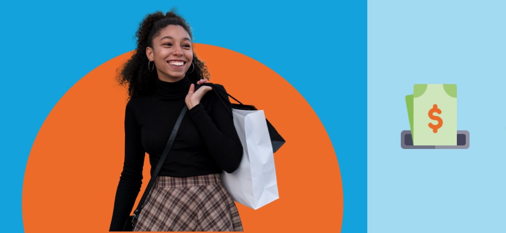 Young girl laughs while carrying a shopping bag and purse